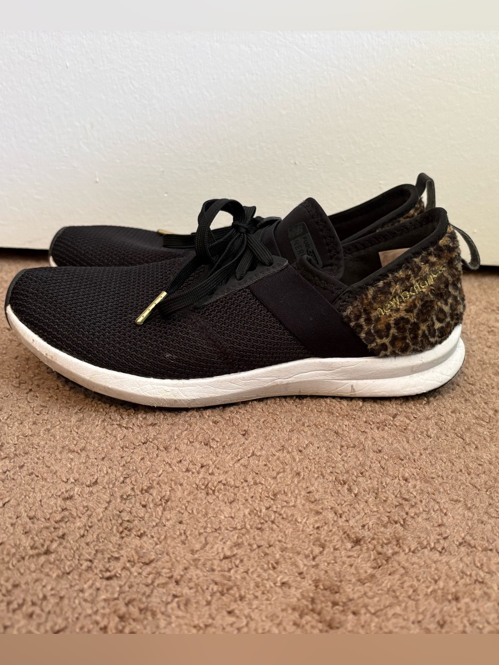 New Balance Black Athletic Sneaker with Leopard Accent